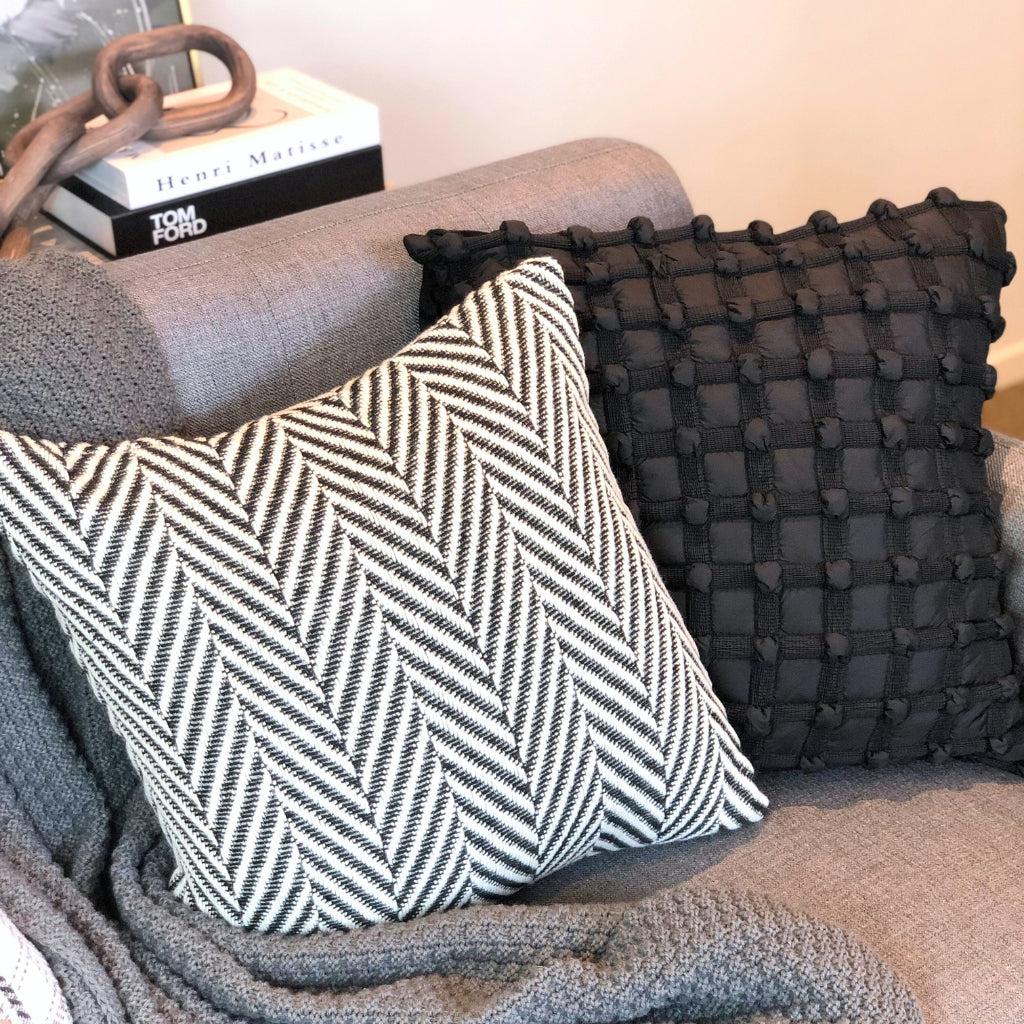 Black textured throw outlet pillow